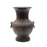 A Chinese bronze archaistic vase, Hu of baluster form with loose ring handles,