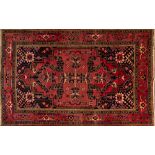 A Heriz carpet, the rose geometric field with a central cruciform medallion,