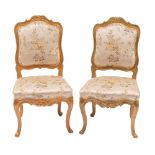 A pair of carved and painted wood salon side chairs in Louis XV style,