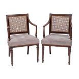 A pair of Regency mahogany and canework library elbow chairs,