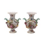 A pair of Meissen flower and fruit encrusted vases of baluster form with acanthus leaf handles,