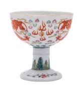 A Chinese famille rose 'dragon' stem bowl: painted with two opposing five-clawed dragons persuing a
