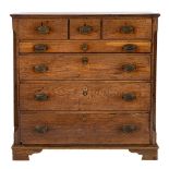 A Regency oak chest of drawers, early 19th century; the top with reeded edges,