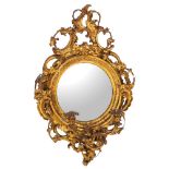 A Regency giltwood and composition framed convex girandole wall mirror,