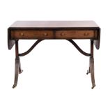 A mahogany sofa table in Regency style,