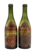 Two 19th century green glass bottles as liqueur decanters with gilt labels for 'SHRUB' and 'MINT',