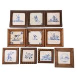 A group of ten Dutch blue and white delftware tiles variously painted with landscapes,