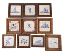 A group of ten Dutch blue and white delftware tiles variously painted with landscapes,