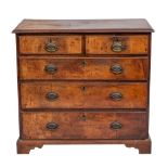 A late George II or George III walnut chest of drawers, circa 1760; the top with moulded edges,