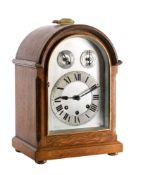 An Edwardian oak Westminster chiming mantel clock,