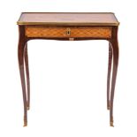 A Continental walnut marquetry petite bureau plat in Louis XV taste,