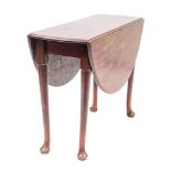 A George II mahogany drop leaf table, mid 18th century; with oval top,