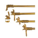 Four gilt metal curtain poles in Empire style, 20th century; comprising a pair,