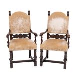 A pair of walnut and velvet upholstered elbow chairs in Continental 17th century taste,