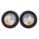 A pair of Italian maiolica roundels after Luca Della Robbia moulded in relief with mythological