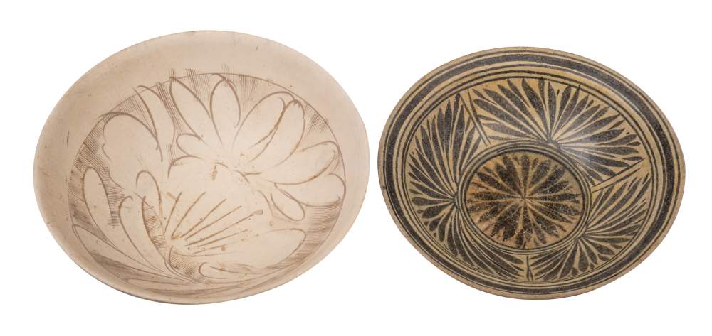 A Chinese Cizhou stoneware bowl and one other, the interior of the first incised with peony sprays,