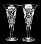 A pair of large trumpet shaped glasses with wheat sheaf and vine decoration,