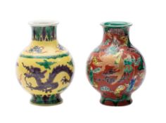 Two Chinese porcelain baluster vases, one painted with Immortals on an iron-red ground,