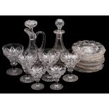 An extensive suite or cut glass goblets of various sizes, decanters and plates.