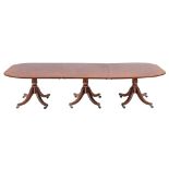 A Regency mahogany triple pillar extending dining table,