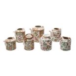 A group of seven Chinese Canton famille rose/verte teapots: of conventional cylindrical form and