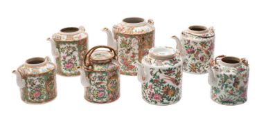 A group of seven Chinese Canton famille rose/verte teapots: of conventional cylindrical form and