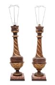 A pair of carved wood and gilt decorated table lamps of urn-shaped outline with slender spiral