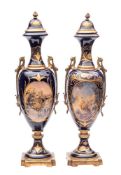 A pair of large Sèvres-style gilt-metal mounted earthenware vases and covers decorated with oval