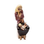 A Lenci earthenware figure 'La Maternita' by Helen König Scavini the mother seated with her baby
