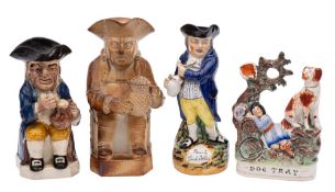 Three Toby jugs and a Staffordshire group,