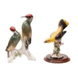 A Sitzendorf porcelain figure of a Golden Oriole and a large Karl Ens figure of two green