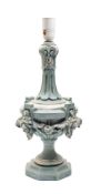 A carved wooden lamp of urn-shaped outline with slender fluted neck,