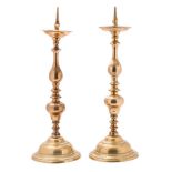 A matched pair of 17th century brass pricket candlesticks in the Dutch taste,