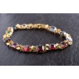 A Victorian, octagonal, step-cut vari-coloured paste and peridot bracelet,