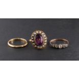 Three rings, including a white paste five stone ring,