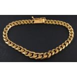 A graduated, flattened curb-link bracelet, stamped '750, total length ca. 19cm, total weight ca. 23.