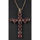 An early 19th century, foil backed garnet, cruciform pendant, length (exl jump ring) ca. 3.