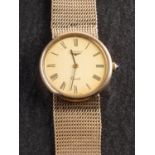 Longines, a gold gentlemans wristwatch the dial with black Roman numerals,