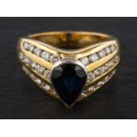 A pear-shaped sapphire and round, brilliant-cut diamond ring, estimated sapphire weight ca. 1.