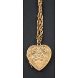 A heart-shaped locket pendant, with floral engraving and hallmarks for Birmingham, 1931,