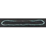 A faceted aquamarine bead necklace, diameter of beads ca. 4mm, the clasp stamped '750', length ca.