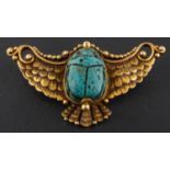 A late 19th/ early 20th century, turquoise faience scarab brooch, the scarab set in a winged mount,