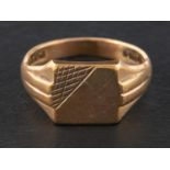 A 9ct gold square signet ring, with reeded shoulders, with hallmarks for London, 1974,