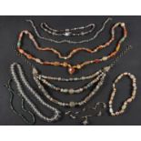 A collection of eight bead necklaces, including three vari-coloured agate necklaces,
