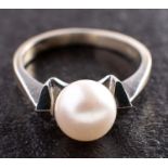 A cultured pearl dress ring, the cultured pearl of white hue with pinkish overtones, diameter ca. 7.