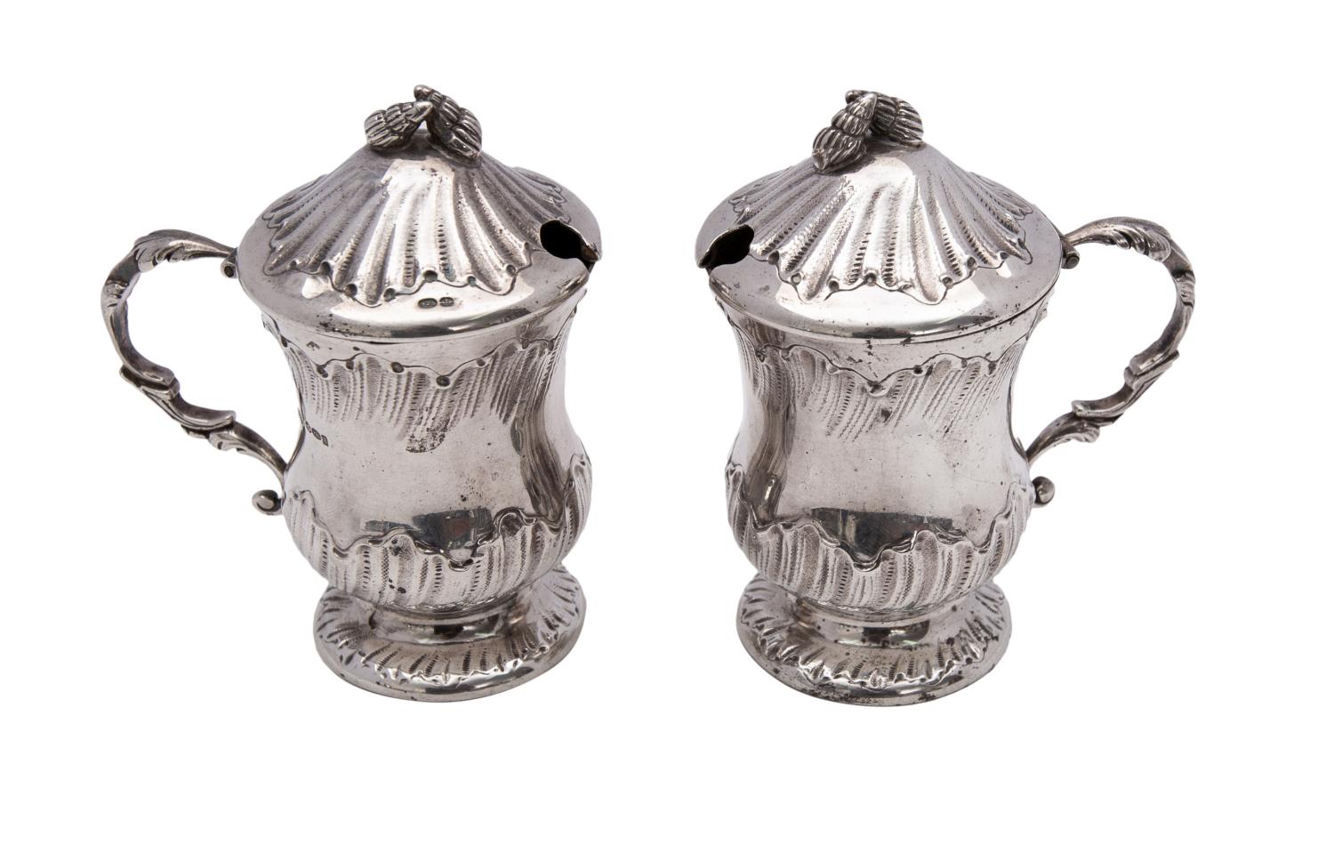 A pair of Continental silver lidded mustard pots, bears import marks for London,