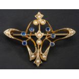 An Art Nouveau sapphire and seed pearl brooch, of whiplash design, stamped '9CT', length ca.