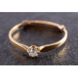 An old-cut diamond single-stone ring and round, brilliant-cut diamond ear studs,