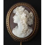 An Etruscan Revival shell cameo depicting a maenad, with ropework surround, total length ca. 4.