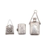 A filigree silver miniature purse 3cm wide, a silver vesta case and small silver scent bottle,